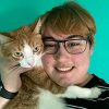 Ace, a person served by NeuroRestorative with his cat